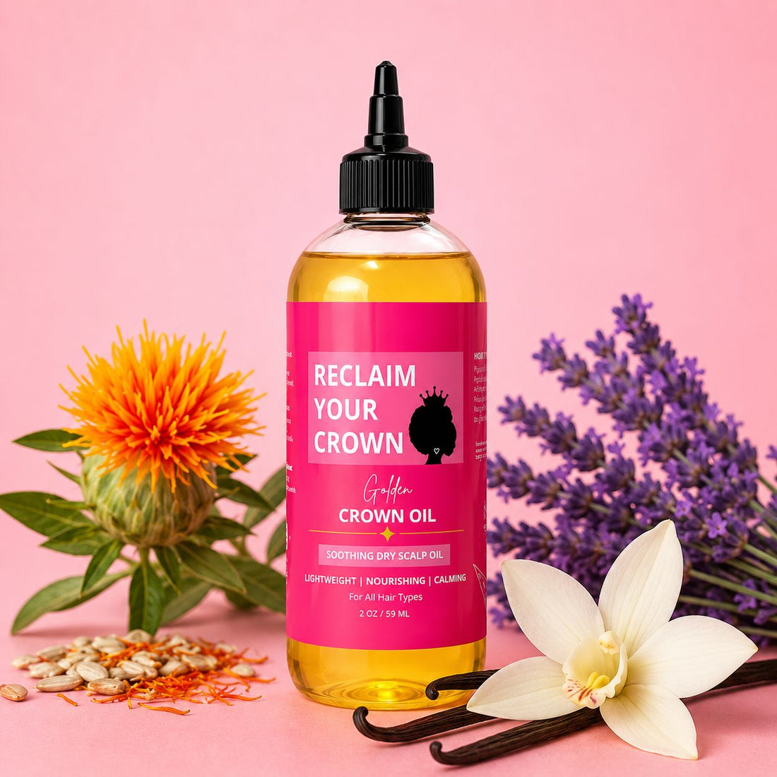 Golden Crown Oil hair and scalp oil bottle surrounded by safflower, lavender, vanilla flower, and vanilla beans on a soft pink background.